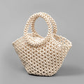 Hand-woven dumpling-shaped maple beach handbag with wooden bead decoration in milky white colour