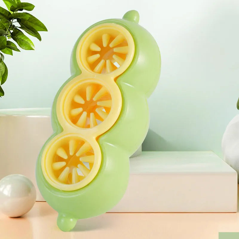 Green dog puzzle toy with food leak openings and bite-resistant material on a white background