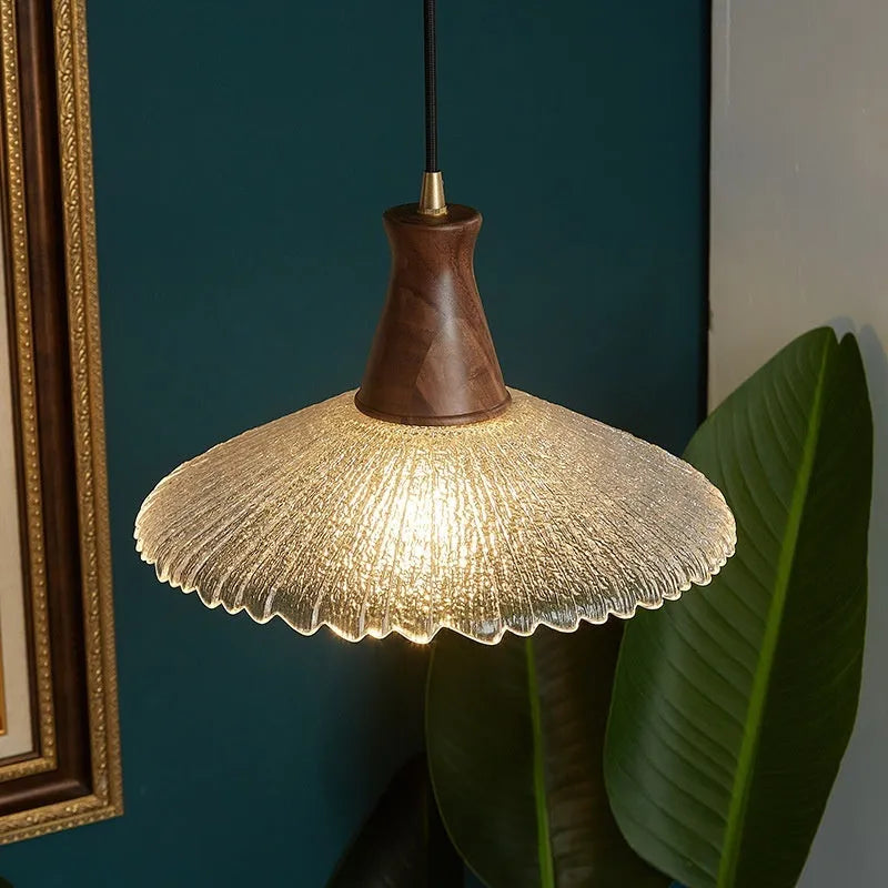 Wood and brass electroplated ceiling chandelier with a glass lampshade.
