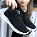 Spring Sole women's casual sports shoes in grey with mesh upper and white PVC sole on a light background