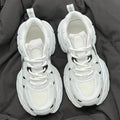 Beige mesh platform casual sports shoes with a wedge heel and front lace-up design on a rubber sole.
