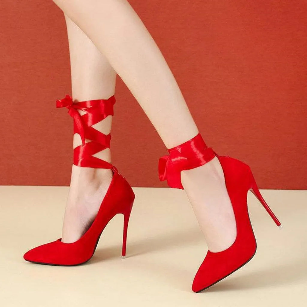 Women's black pointed toe stiletto heels with a thin shallow mouth and lace ankle strap.