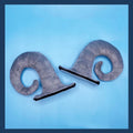 Pair of composite fibre demon horns for motorcycle helmet customisation in black, pink, brown, or grey.