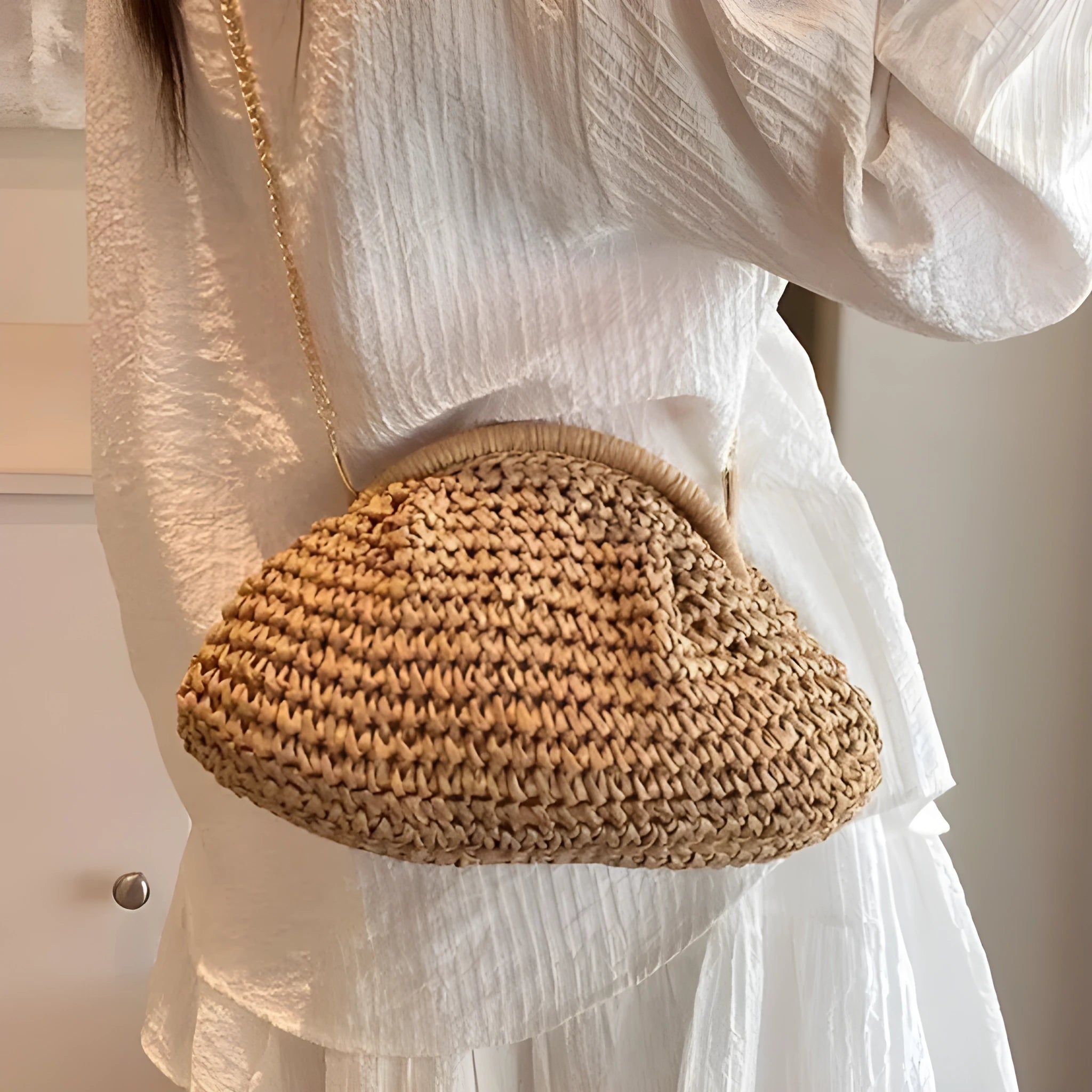 Women's khaki shell-shaped straw shoulder bag with a chain strap detail