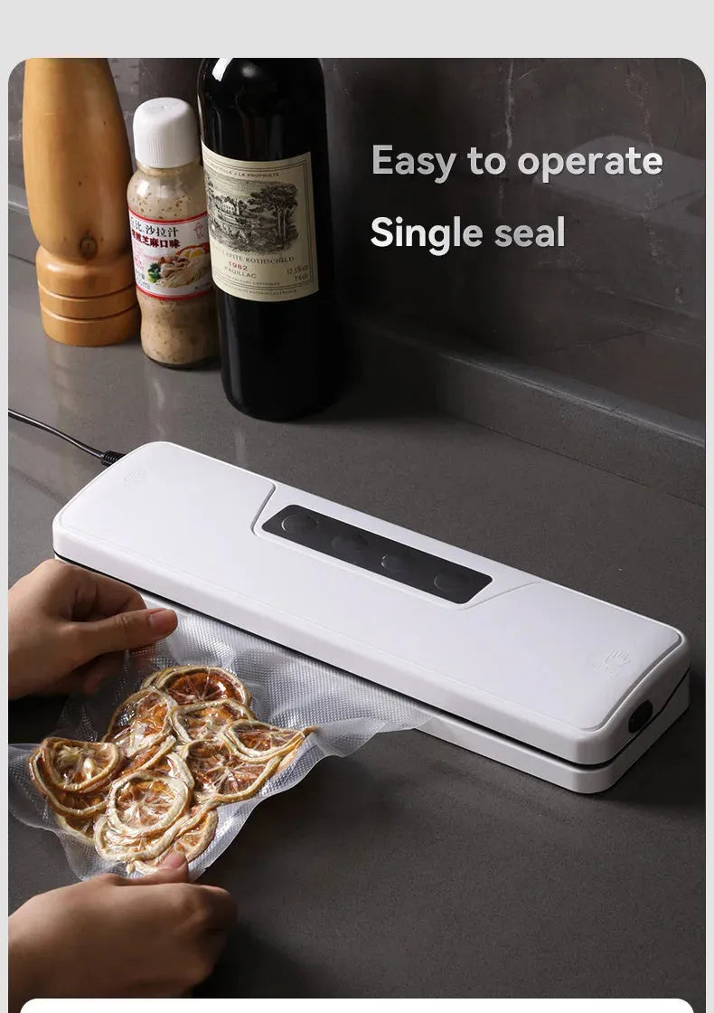 White automatic vacuum sealer machine on a kitchen counter
