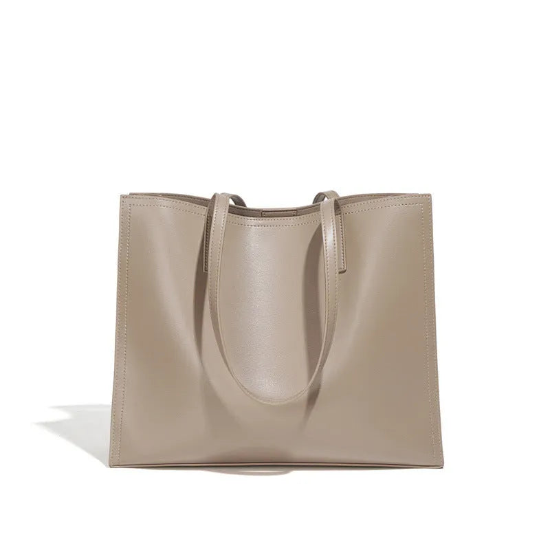 Women's brown genuine leather one shoulder handbag with horizontal square shape showing interior organisation compartments