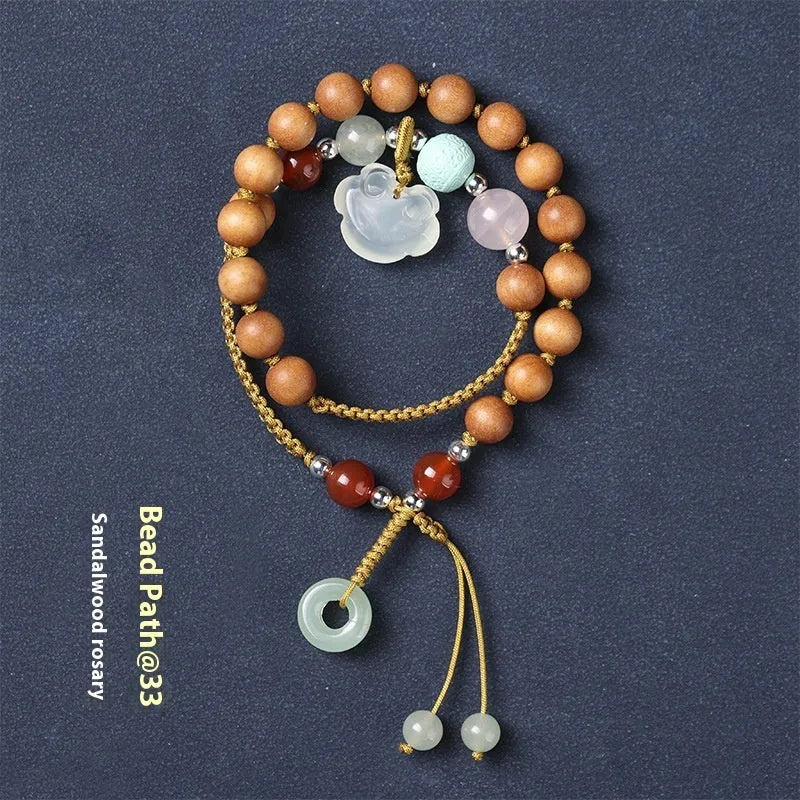 Hand-woven ebony double ring bracelet for women in national style with Ruyi motif.