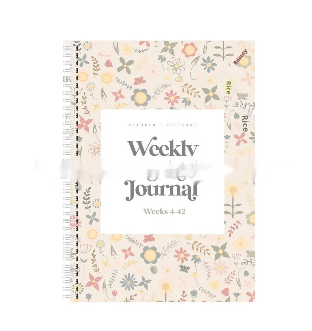 A5 size weekly pregnancy diary notebook open on a page showing weekly layout