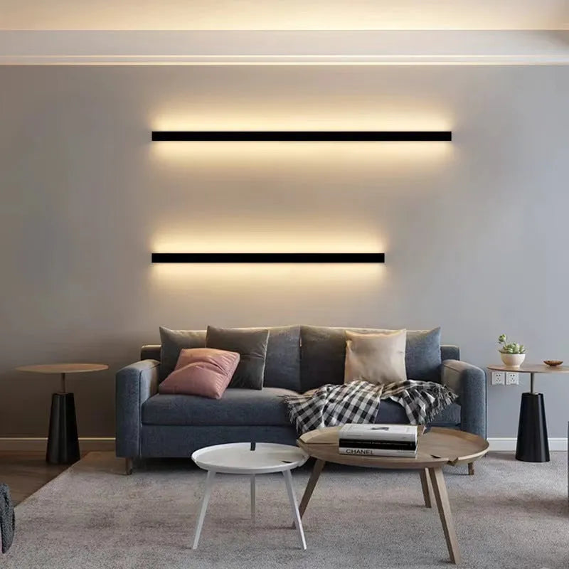 Black 80cm long aluminium LED strip wall lamp mounted on a wall with touch control for colour changing.