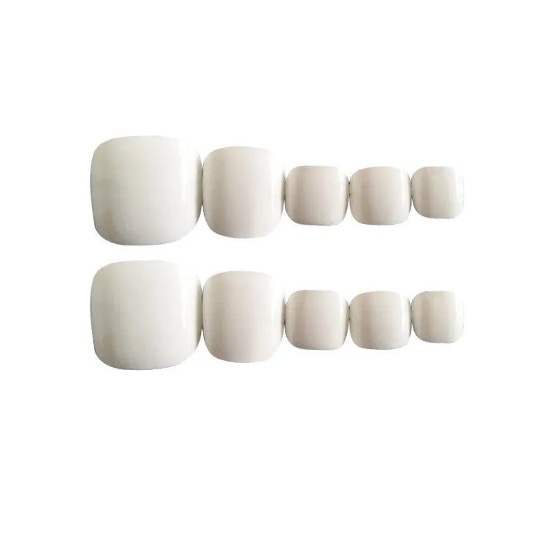 Set of women's press-on false nails with white starry sky pattern and included glue bottle