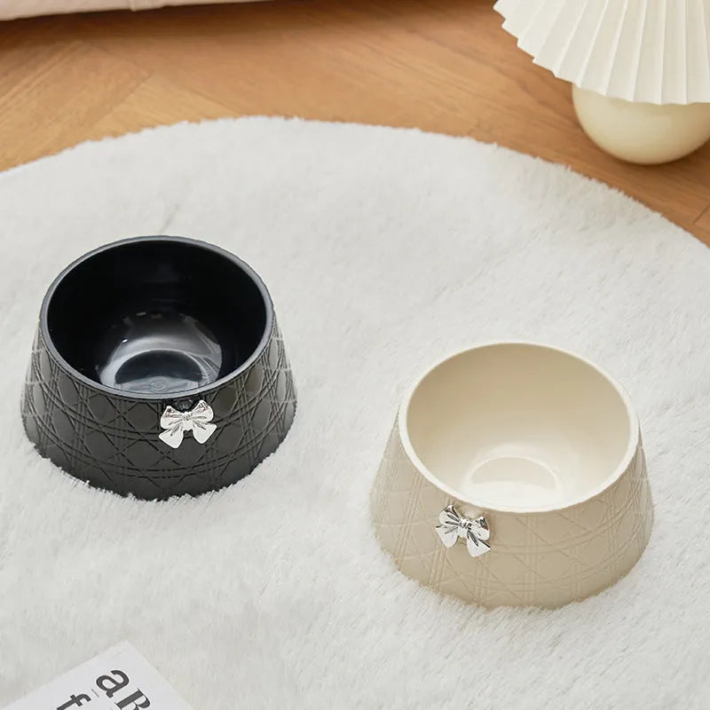 Ceramic pet bowl with diamond pattern and a bowknot decoration in pink, silver, black, purple, or white