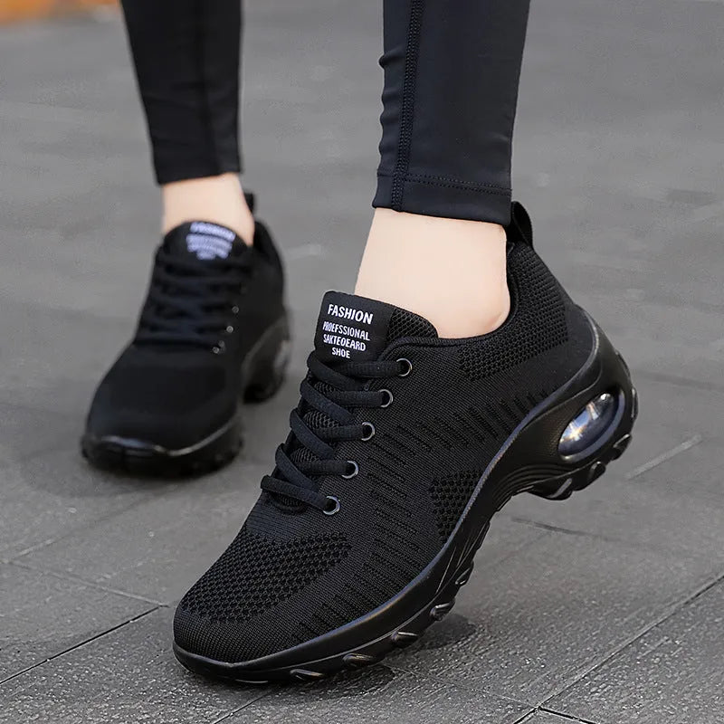 Women's red and black mesh lace-up sneakers with round toe and flat 3-5cm heel on a white background.