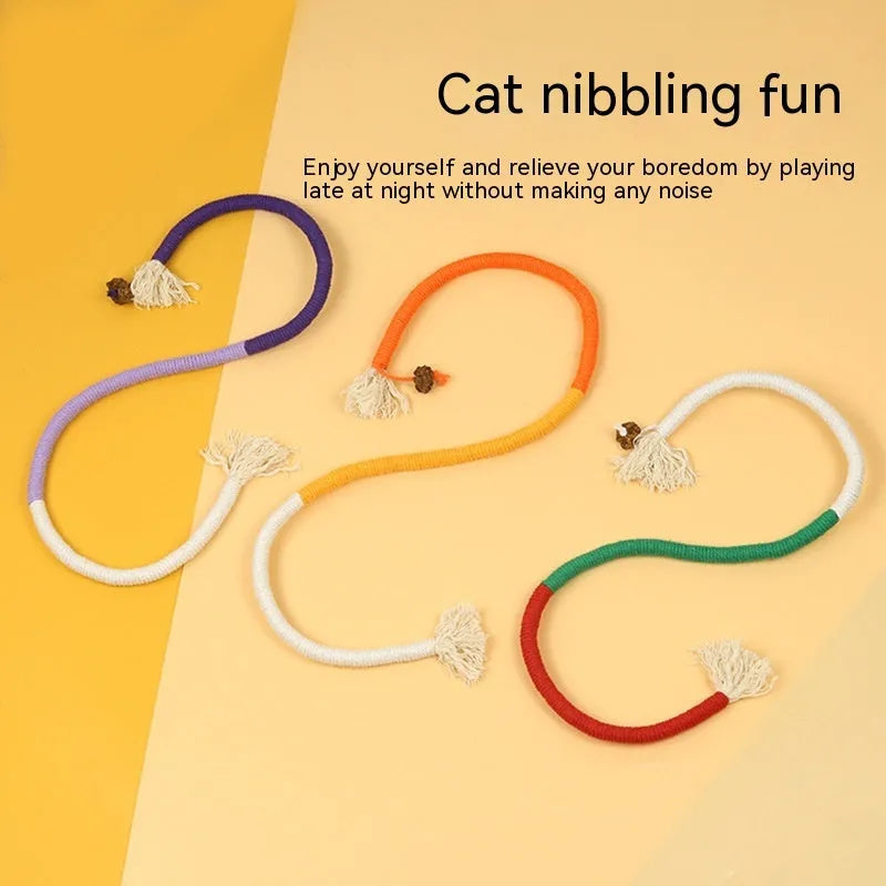 Cat bite rope toy in full orange colour made of cotton thread with attached teaser stick