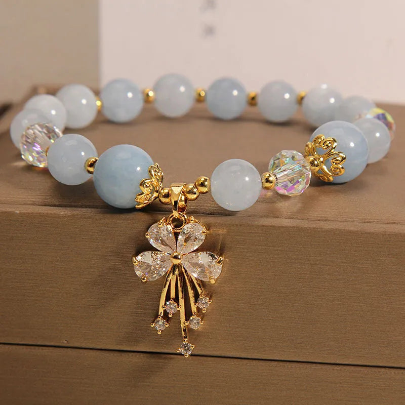 Normcore style unisex crystal lucky pearl bracelet aquamarine butterfly pink crystal butterfly on neutral background