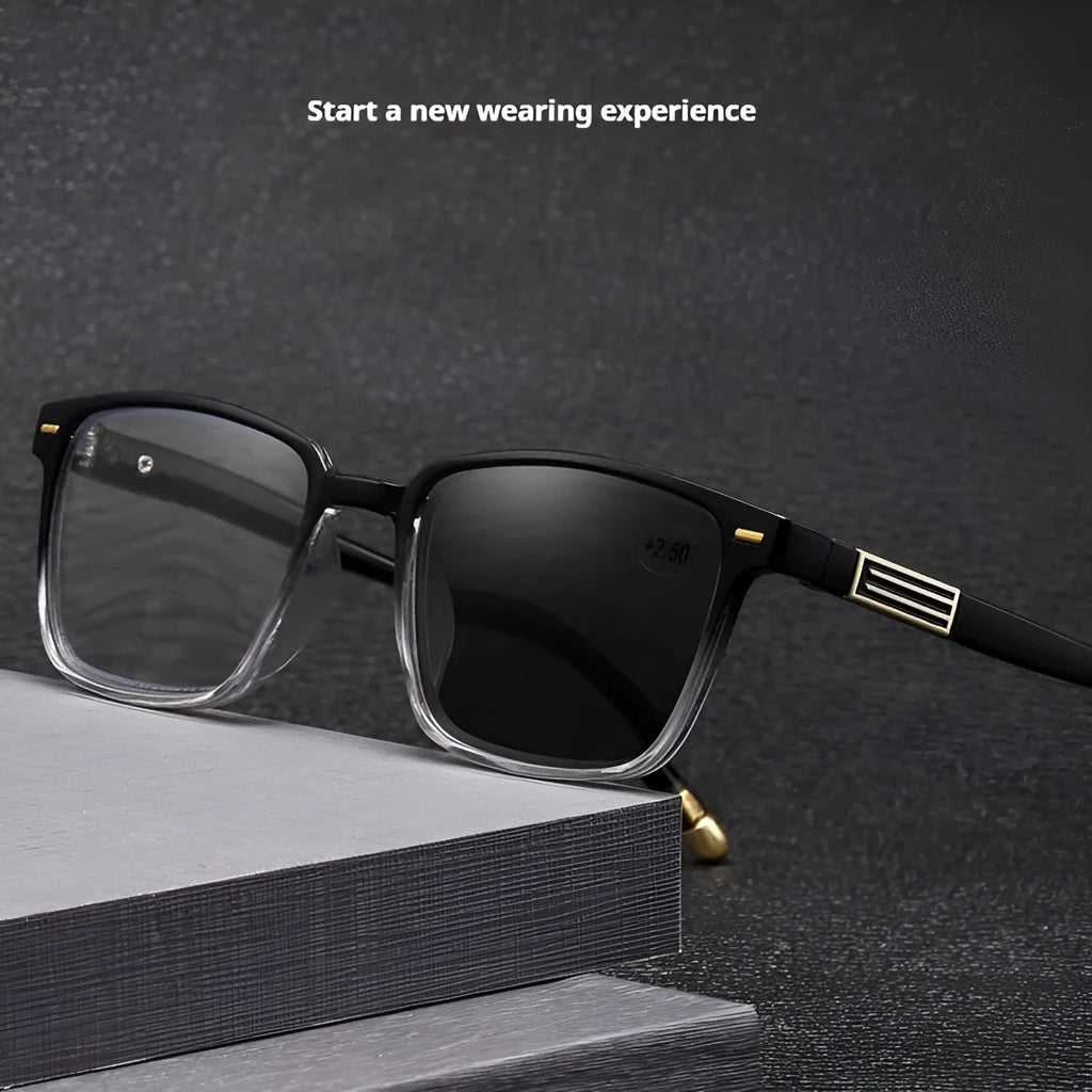 A pair of black multifocal reading glasses with metallic arms and colour-changing, anti-blue light lenses.