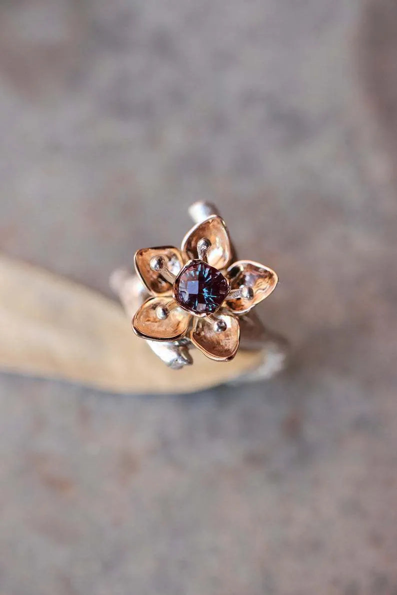 Silver two-tone floral geometric women's fashion ring made from alloy.