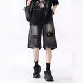 Men's washed denim shorts with ripped detailing in black or blue, showing loose retro style and fifth-pants length