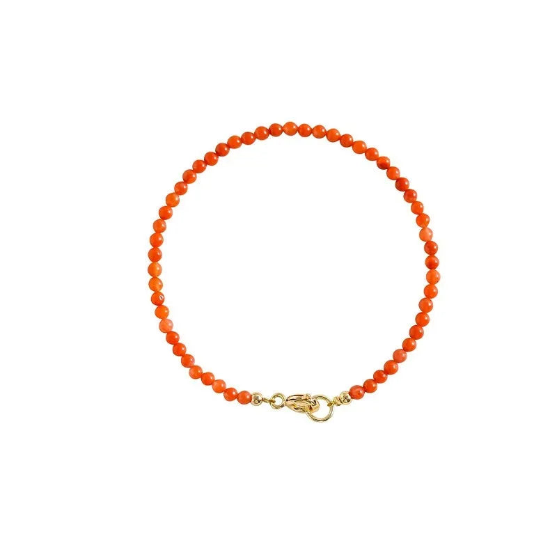 Women's retro bracelet with natural southern red agate beads in cherry red and persimmon red on a white background.