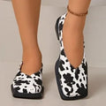 Women's black and white cow pattern flat shoes in first layer cowhide with 6-8cm high heel and rubber sole