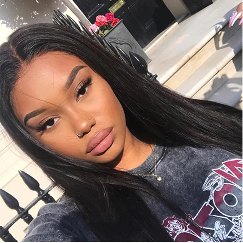 Long straight black synthetic wig with centre-parted bangs on a mannequin head.