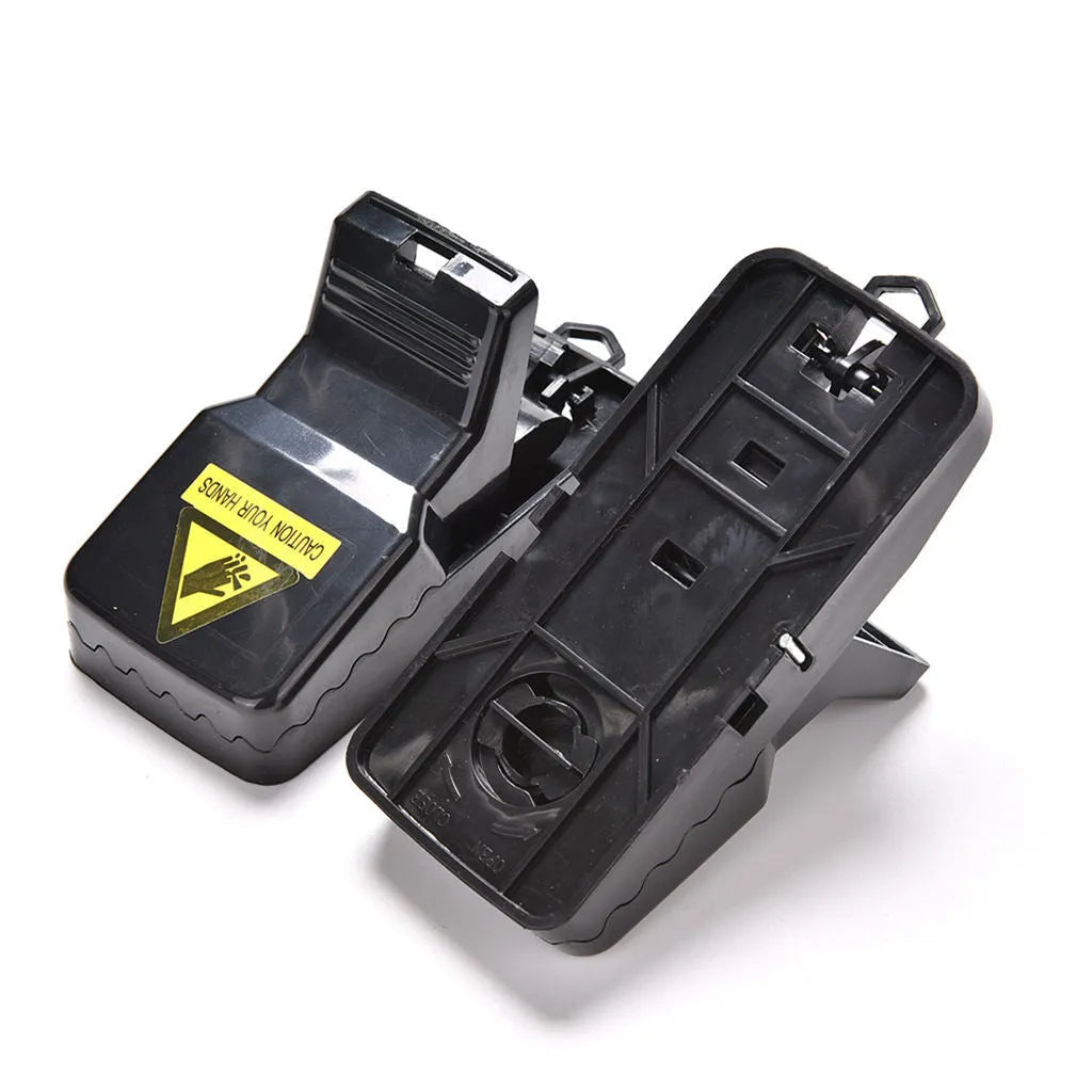 Six black snapping mousetraps showing PC+ABS plastic construction and bite-type mechanism