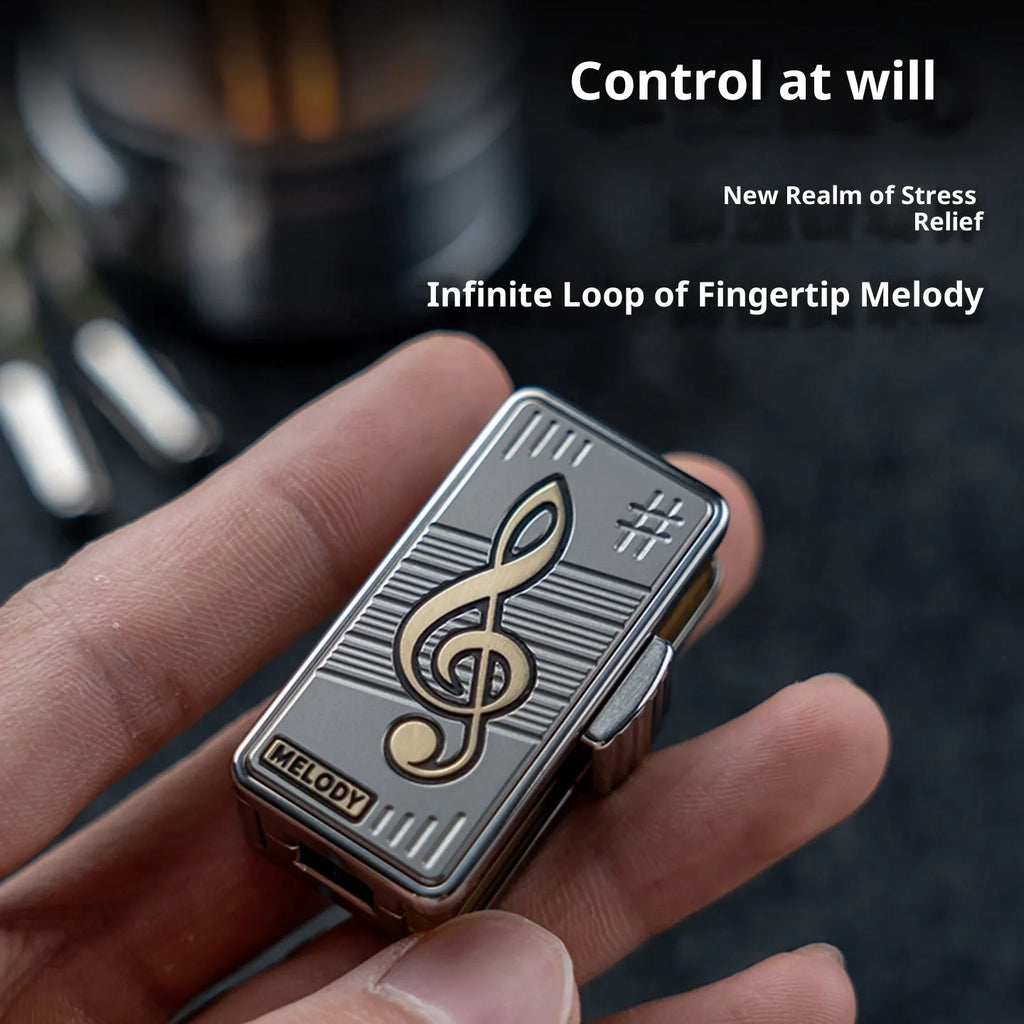 Titanium alloy mechanical scale push EDC fingertip decompression toy in Melody colour shown on a desk