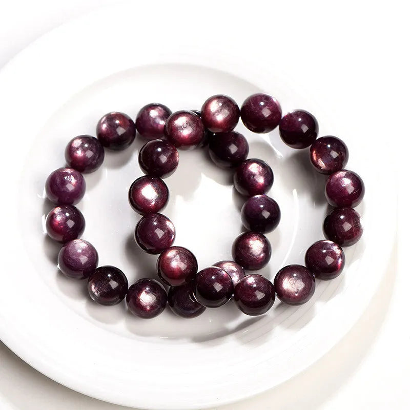 Purple lepidolite crystal bracelet with round polished beads showing selectable size options.