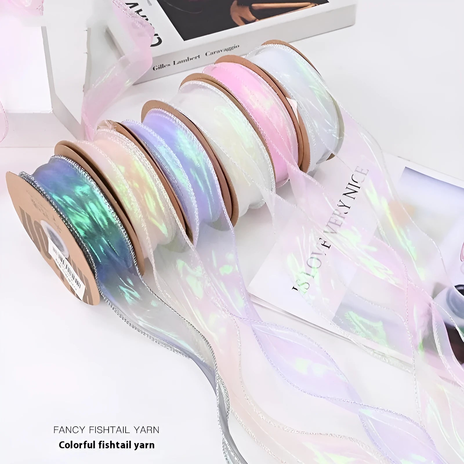 Roll of colourful wave fishtail yarn ribbon in illusion champagne colour, showing textured pattern and 4cm width.