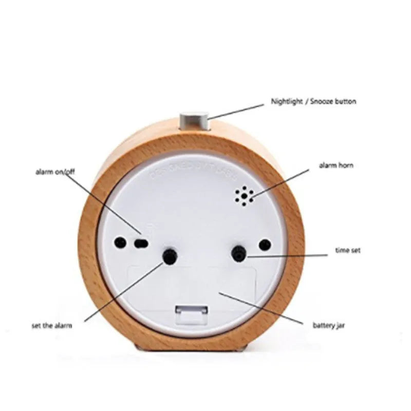 Solid beech wood analogue alarm clock with silent snooze on wooden surface