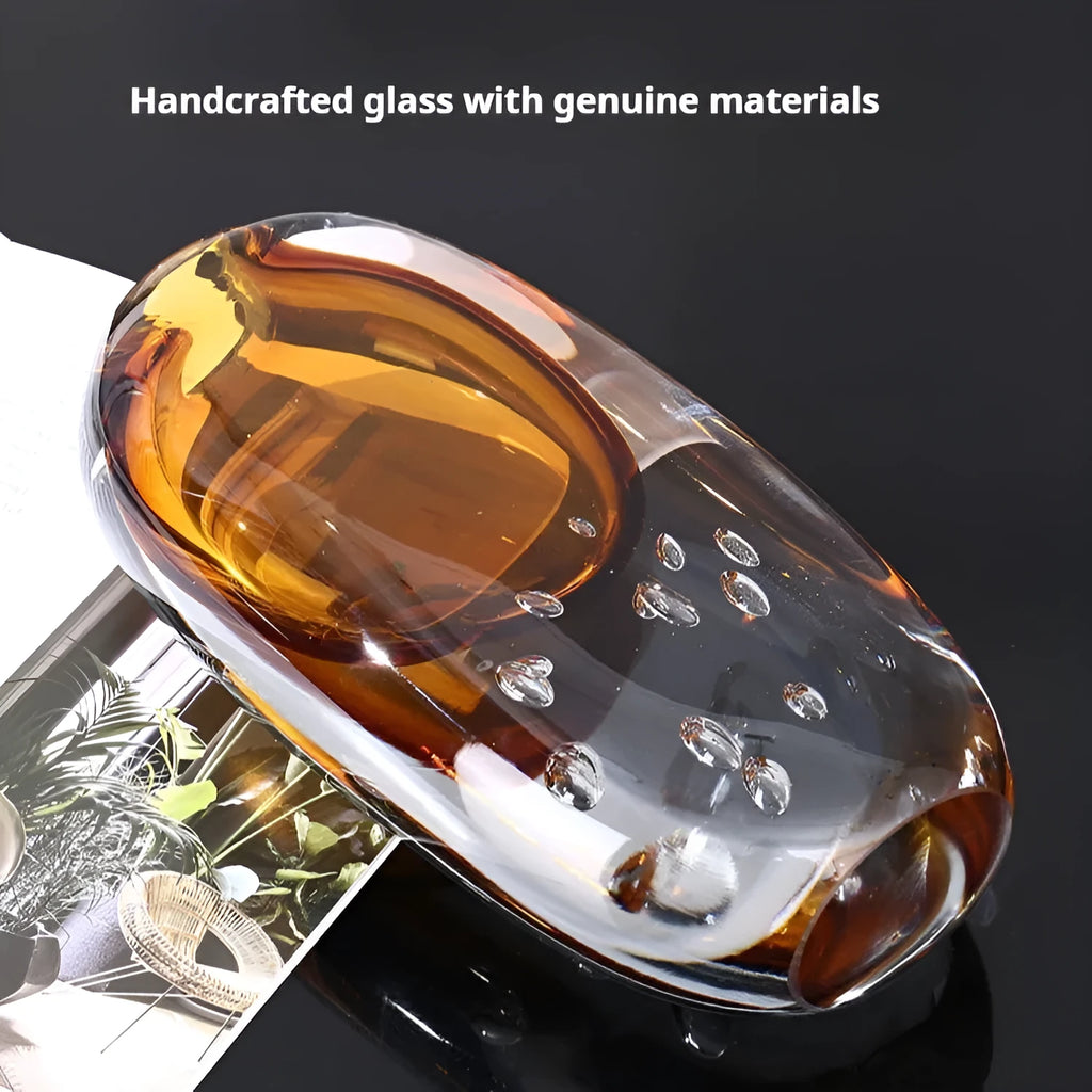 Glass vase with coloured glaze finish in amber, abstract shape, 13.5x25cm size on tabletop
