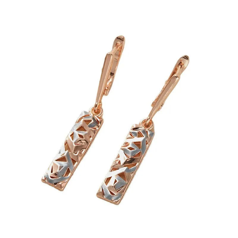 Rectangular two-tone hollow stud earrings with electroplated finish and geometric design