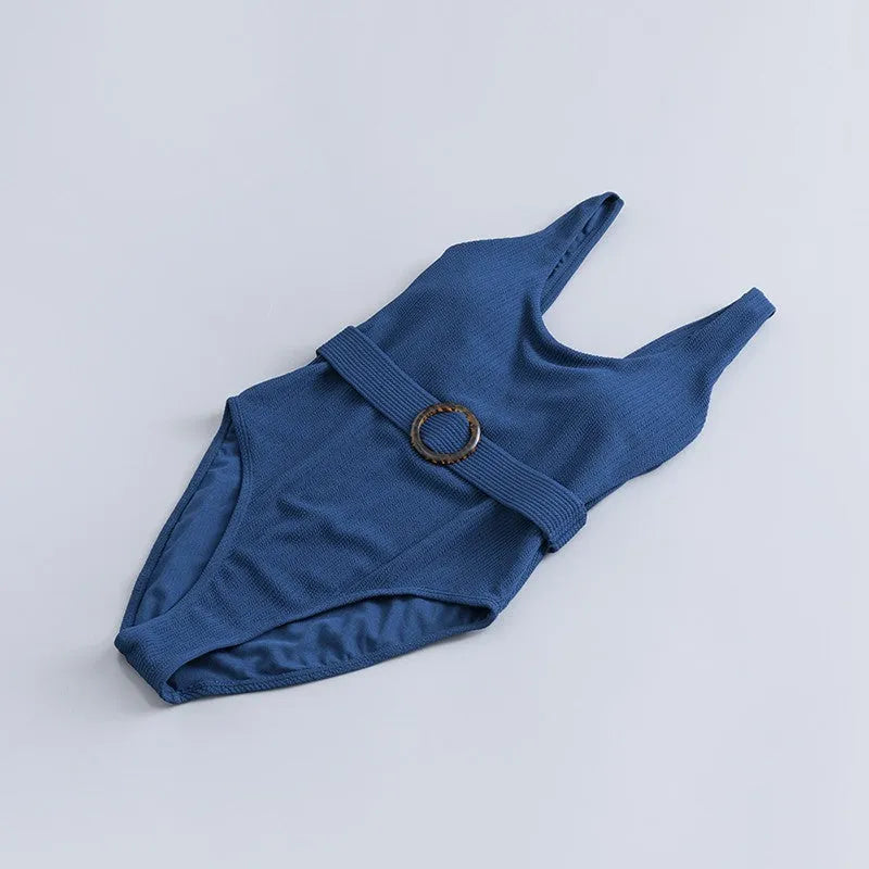 Navy blue women's one-piece slimming swimsuit with triangle neckline and chest pad.