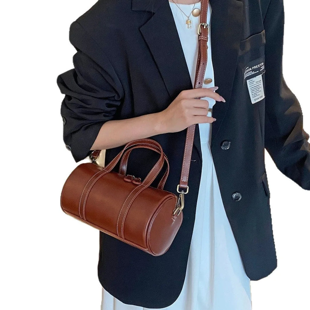 Cortex women's genuine leather crossbody bag in pillow shape with patchwork design, 24x12x13cm, available in black