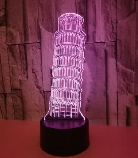 3D laser-cut Leaning Tower of Pisa acrylic night light glowing in blue on a black base.
