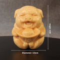 Solid bamboo carving ornament with cute pig design measuring 4cm tall by 3.5cm diameter