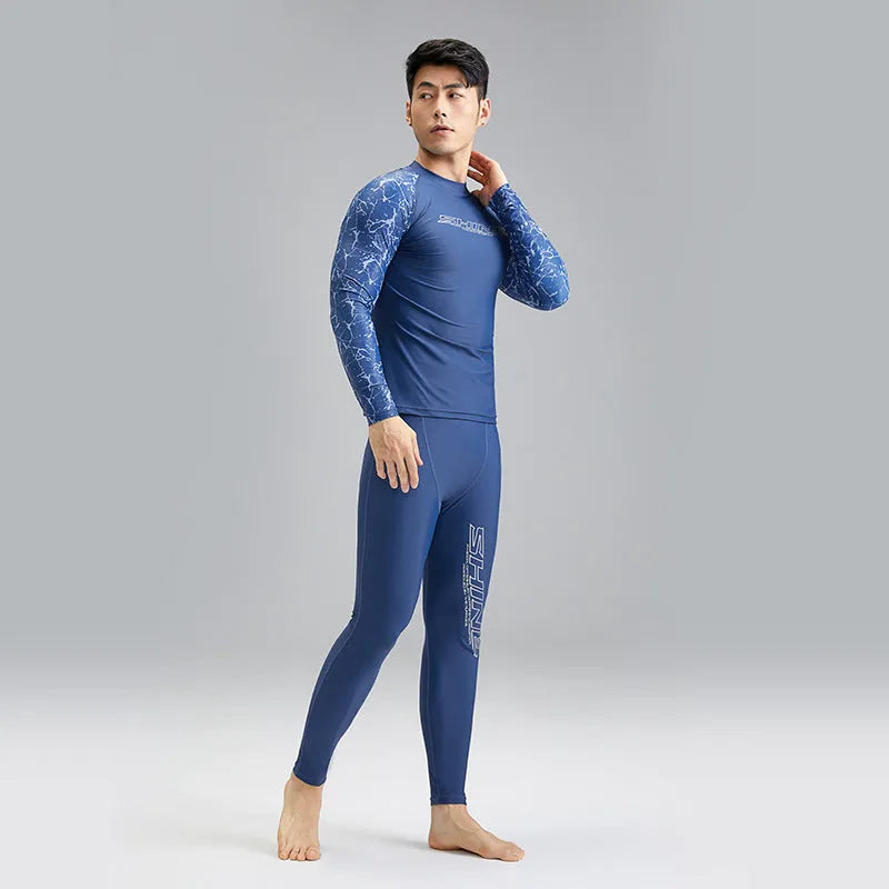 Men's dark blue patterned nylon swimwear set with matching top and trousers