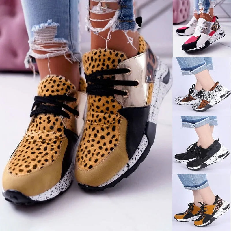 Women's casual wedge heel sneakers in suede, showing round toe and low-cut profile on a wooden floor.