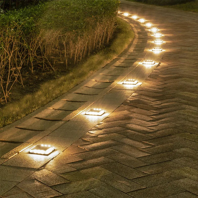 Solar floor tile lamp with aluminium body and glass shade on outdoor staircase for courtyard decoration