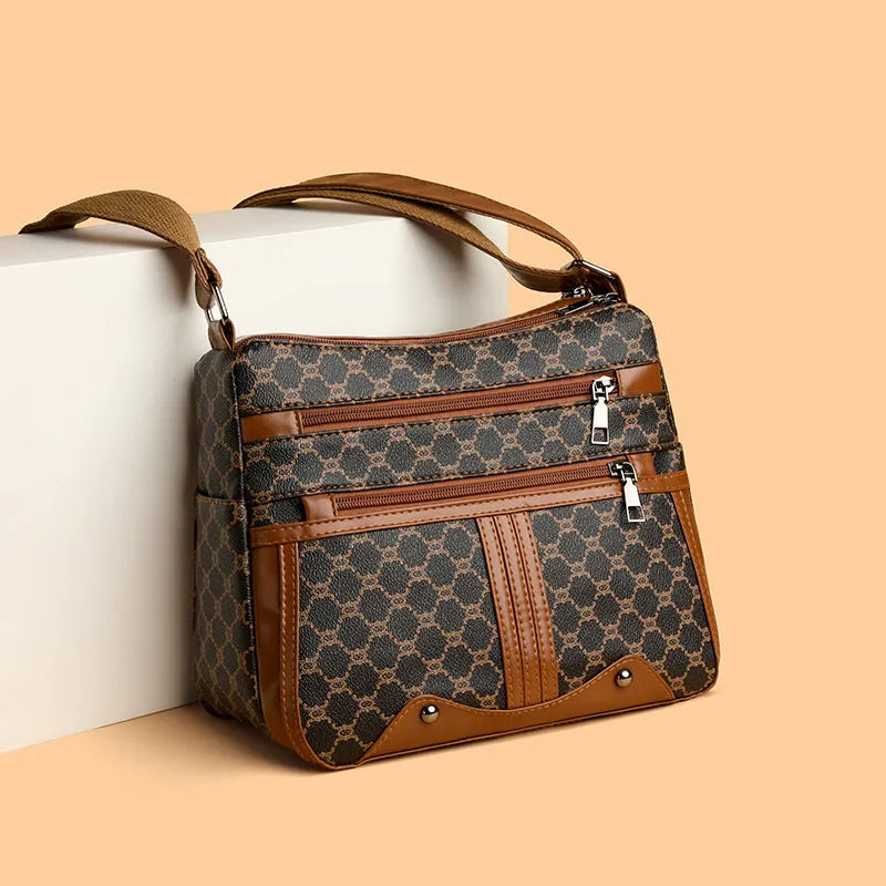 Brown stitching pattern crossbody bag with adjustable strap and polyester lining