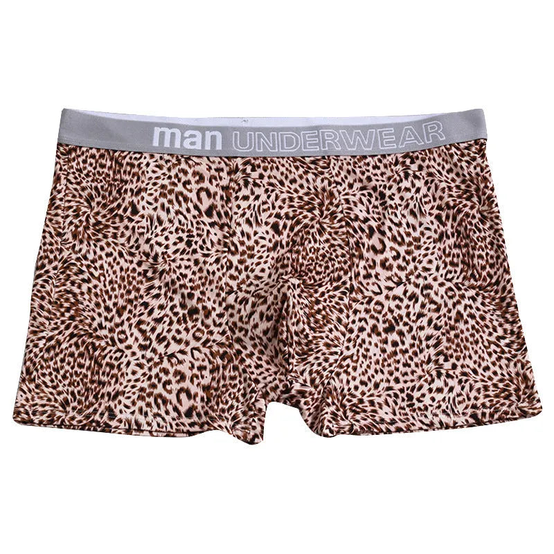 Men's loose fit leopard print boxer shorts in polyester milk silk fabric showing mid-waist design