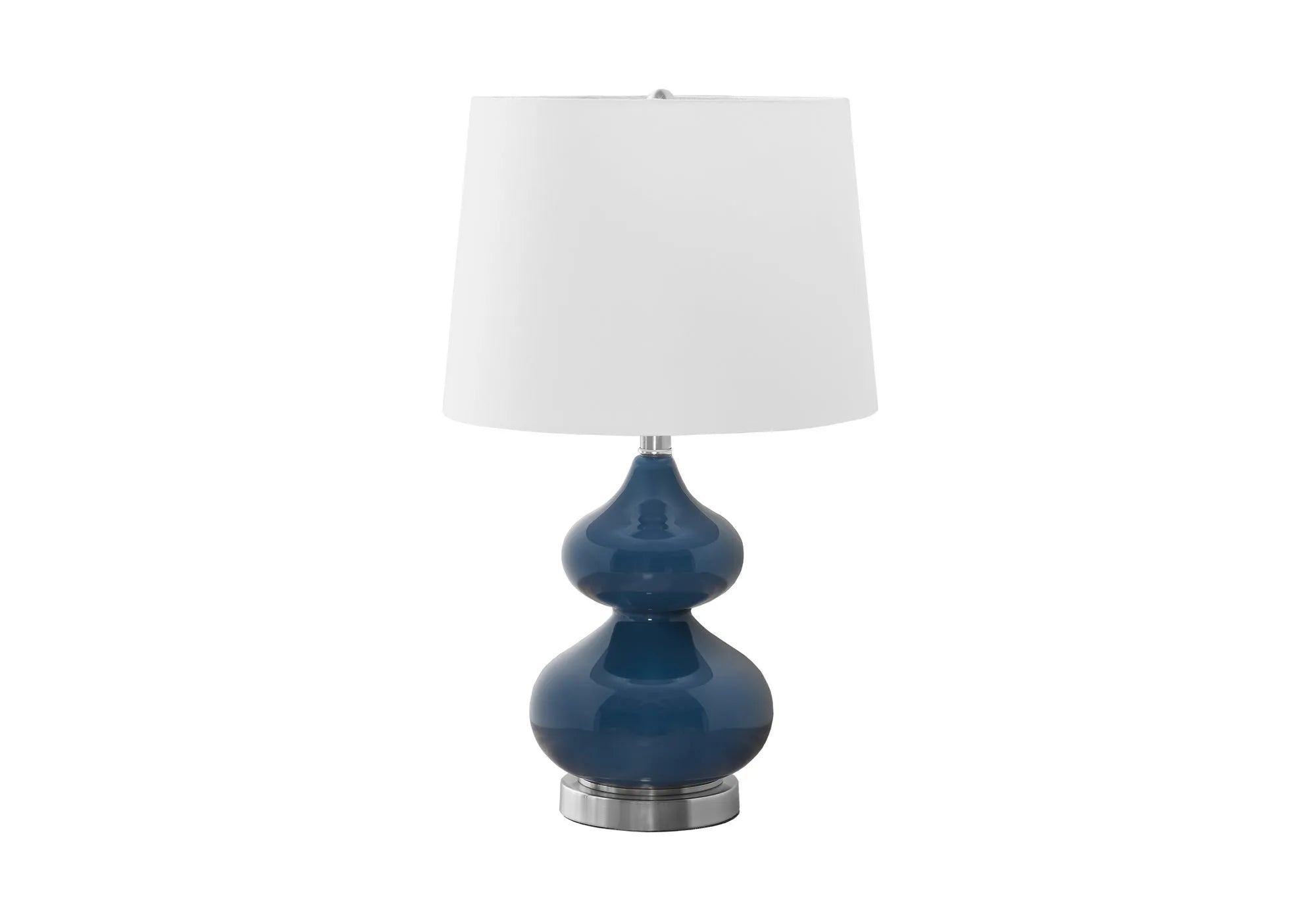 Blue cloth shade desk lamp with a clear crystal glass base on a wooden desk.