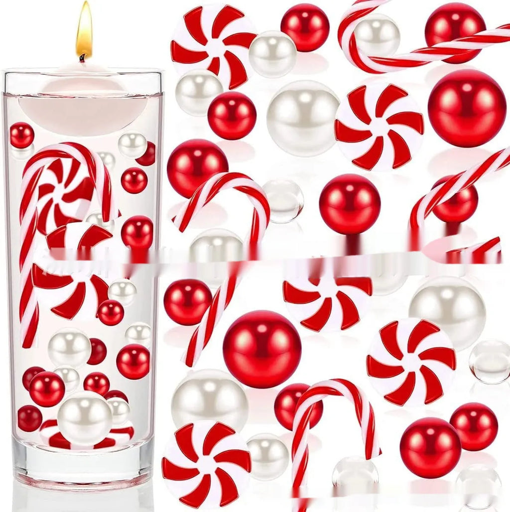 Two red floating stuffed vase Christmas decorations in cup shape on a wooden table