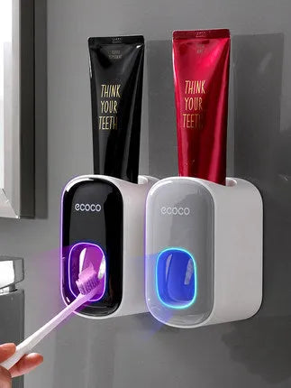 Wall mounted automatic toothpaste dispenser with toothbrush holder and mouthwash cup in black plastic