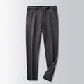 British retro style striped straight-leg trousers in a khaki colour, showing zip fly and classic cut.