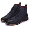 Men's black leather motorcycle boots with silver metal belt buckle fastenings on the side, showing a thick rubber sole.