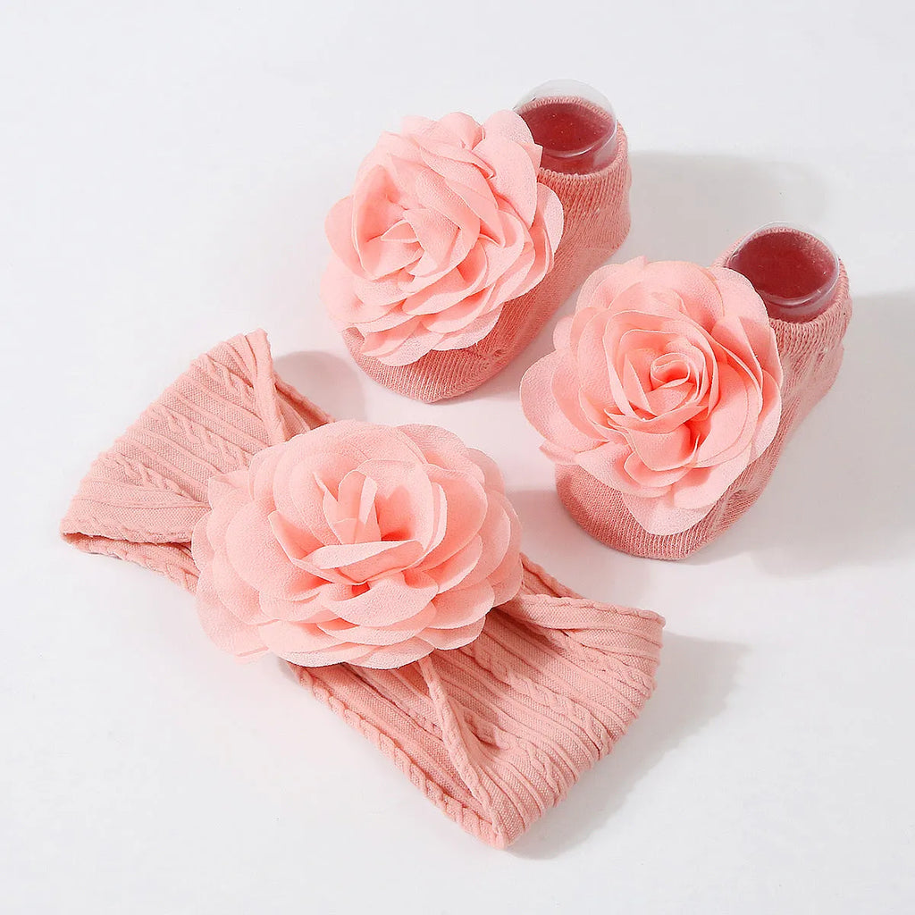 Baby hair band and socks set in nylon with flower-lifting design, available in multiple colours