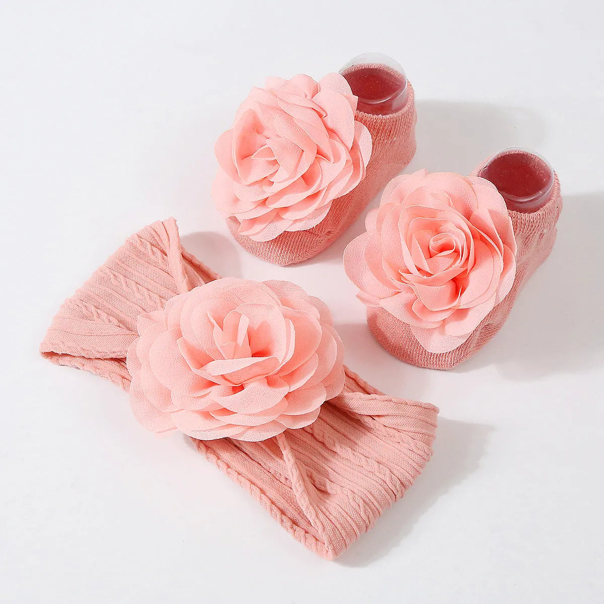 Baby hair band and socks set in nylon with flower-lifting design, available in multiple colours
