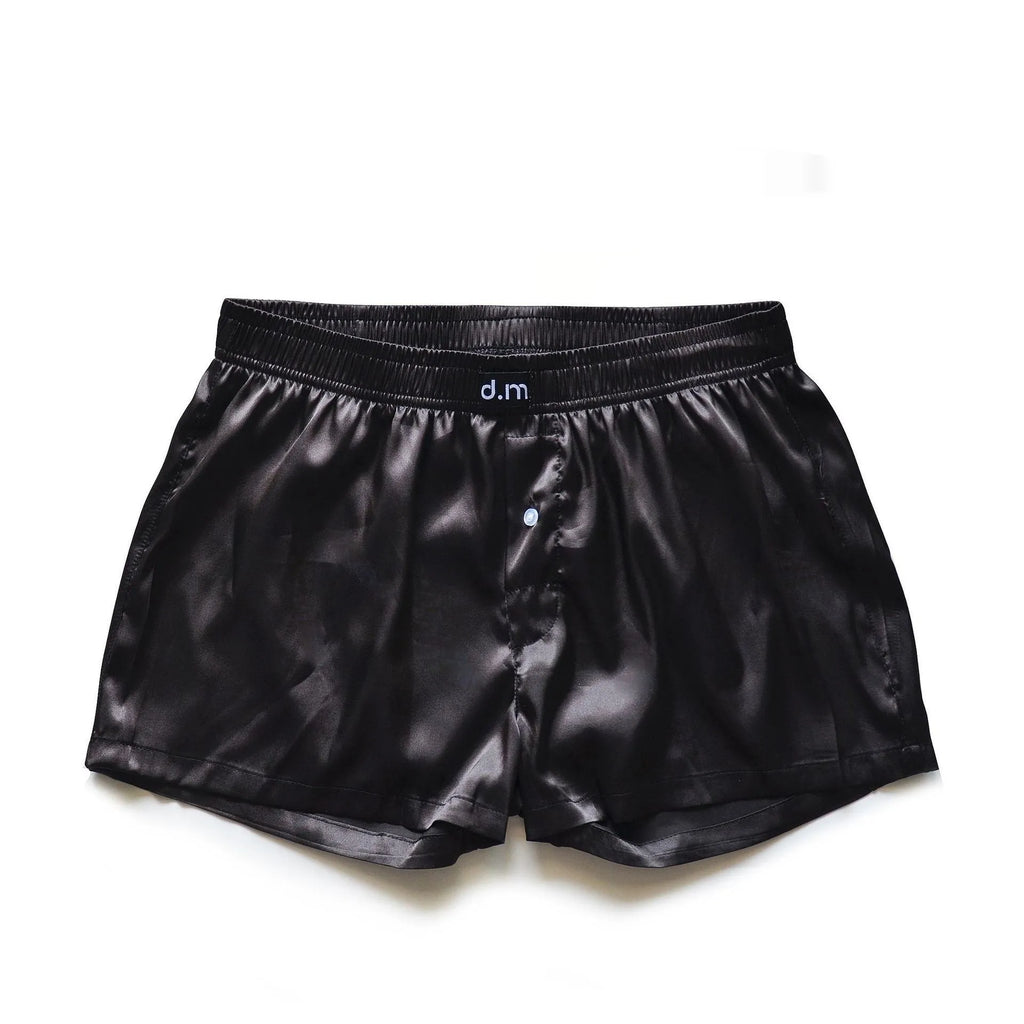 Men's low-waist silky boxer polyester pajama shorts in black brown, front view on white background