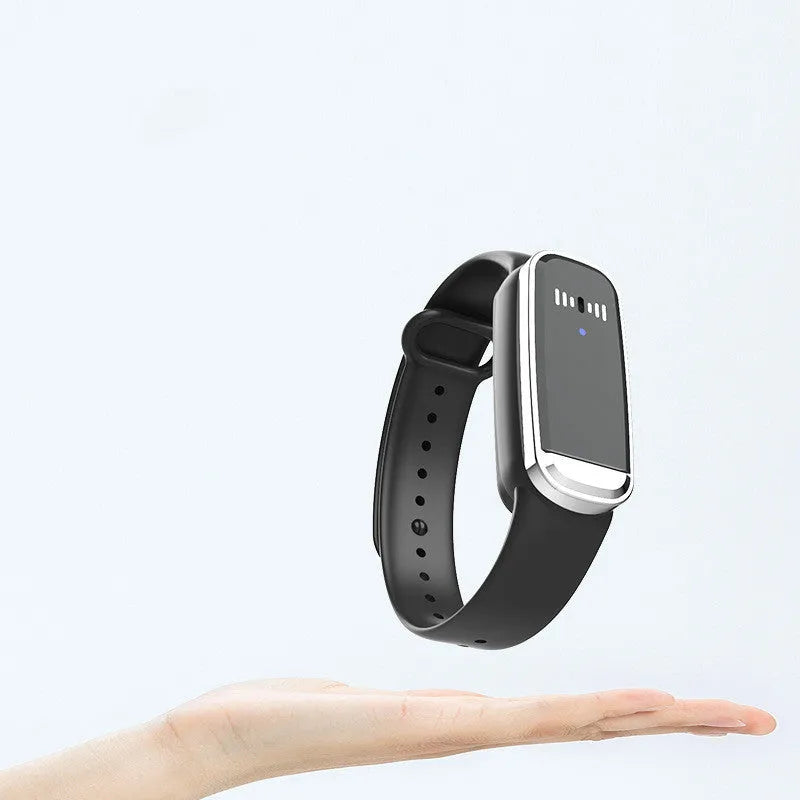 Black and white ultrasonic mosquito repellent bracelet with USB charging cable on wrist