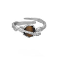 Silver Saturn open ring with tigereye detail and white gold-coloured electroplated finish, adjustable opening